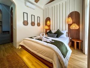 Postel nebo postele na pokoji v ubytování Landmark Villas