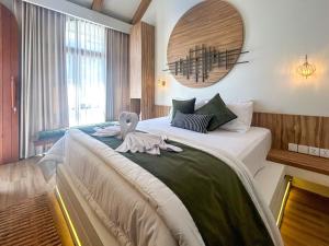 Postel nebo postele na pokoji v ubytování Landmark Villas