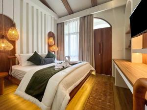 Postel nebo postele na pokoji v ubytování Landmark Villas