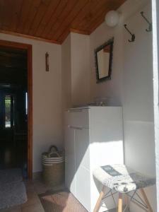 a kitchen with a table and a chair in a room at Cozy vacation house in Gabrovka