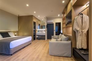 Ένα ή περισσότερα κρεβάτια σε δωμάτιο στο Evanik Chic Hotel