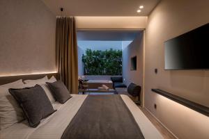 Ένα ή περισσότερα κρεβάτια σε δωμάτιο στο Evanik Chic Hotel