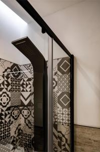 a stair case with a patterned wall at Luxury 2BR Maisonette in Sliema Private Hot Tub in Sliema