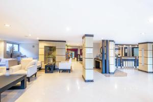 a lobby of a hospital with tables and chairs at Viking Nona Beach in Kemer +77 photos