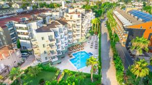 an aerial view of a city with palm trees and buildings at Viking Nona Beach in Kemer