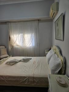 Postel nebo postele na pokoji v ubytování ΜΑΡΙΑ η ΧΑΛΚΙΔΕΑ