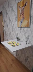 a table with a picture of a giraffe wearing a hat at L'Eldorado du Léman in Annemasse