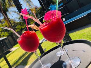 two cocktails in wine glasses sitting on a table at 30 on Bergh in Louis Trichardt