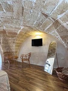 TV a/nebo společenská místnost v ubytování Midi Pool Villa & SPA