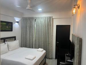 Henmil Hotel客房内的一张或多张床位