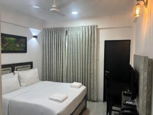 Henmil Hotel客房内的一张或多张床位