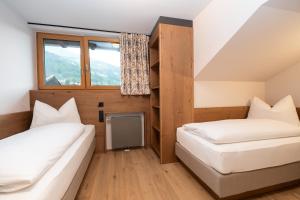 Postelja oz. postelje v sobi nastanitve PRIVATE HOMES Alpin Spa Apartments