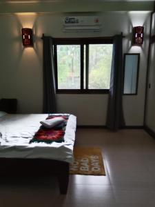 Postel nebo postele na pokoji v ubytování Private Beachfront Villa in Siargao