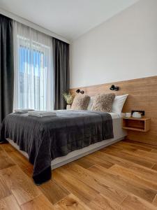 Posteľ alebo postele v izbe v ubytovaní Apartamenty Mieczysława Gorzki