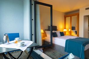 Postel nebo postele na pokoji v ubytování Garner Hotel Rüsselsheim by IHG