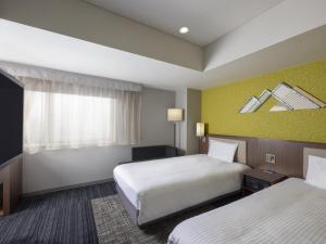 Postel nebo postele na pokoji v ubytování ibis Styles Kyoto Shijo + 37 fotografií