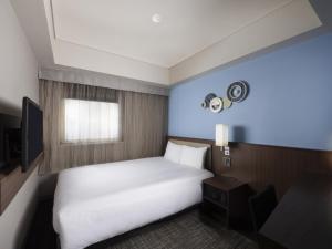 ibis Styles Kyoto Shijo客房内的一张或多张床位