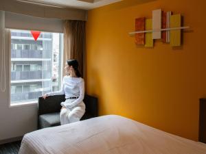 ibis Styles Kyoto Shijo客房内的一张或多张床位