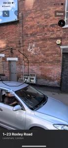 a car parked in front of a brick building at Jerome 1 in London