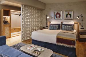 a hotel room with a bed and a couch at Palacio de Samaniego in Samaniego +105 photos