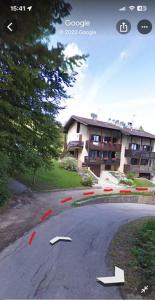 an empty street with a building in the background at Casa Vacanze Vigolana in Centa San Nicolò
