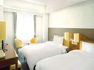 เตียงในห้องที่ Prince Smart Inn Nagoya Sakae