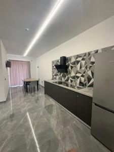 a living room with a table and a dining room at Residenza Rizzo Paestum in Paestum