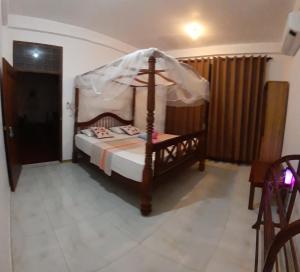 Voodi või voodid majutusasutuse Sasagara Beach Villa toas