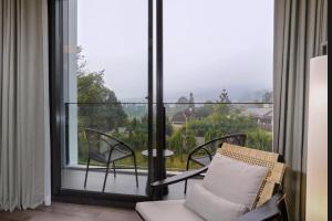 Balkón nebo terasa v ubytování Grand Aston Puncak Hotel & Resort