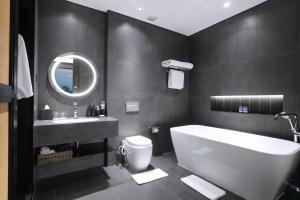 Koupelna v ubytování Grand Aston Puncak Hotel & Resort