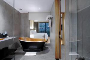 Koupelna v ubytování Grand Aston Puncak Hotel & Resort
