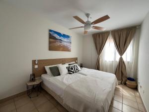 a bedroom with a bed and a ceiling fan at Ocean Dream Apartment in Playa Jandia