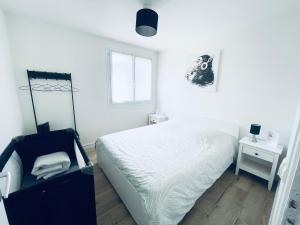 Posteľ alebo postele v izbe v ubytovaní Grand T2 au RDC hyper centre Navette et Sauna en option