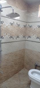 a bathroom with a toilet and a sink at Guba House Near Forest & Lake in Quba +35 photos
