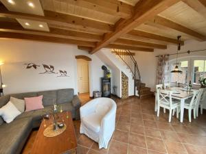 a living room with a couch and a table at Ferienhaus Am Stein in Sternberg