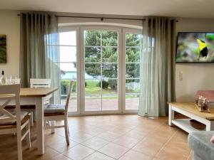 TV a/nebo společenská místnost v ubytování Ferienhaus -Möwennest- + 13 fotografií