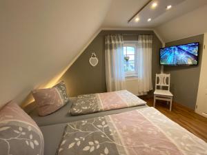 Postel nebo postele na pokoji v ubytování Ferienhaus -Möwennest-