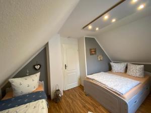 Postel nebo postele na pokoji v ubytování Ferienhaus -Möwennest-