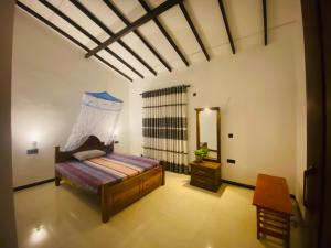 A bed or beds in a room at Priyavimana resort