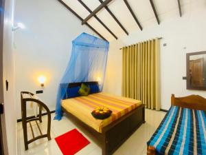 A bed or beds in a room at Priyavimana resort