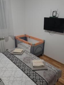 Uma cama ou camas num quarto em Apartman Luka