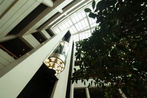 a building with a glass ceiling with a light at Sofitel Luxembourg Europe in Luxembourg
