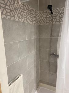 a bathroom with a shower with a shower at Cranley in Carshalton +83 photos