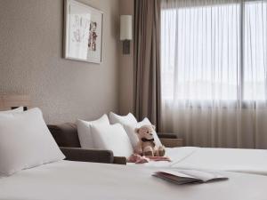 Postel nebo postele na pokoji v ubytování Novotel Athens