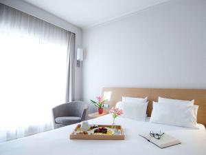 Postel nebo postele na pokoji v ubytování Novotel Athens