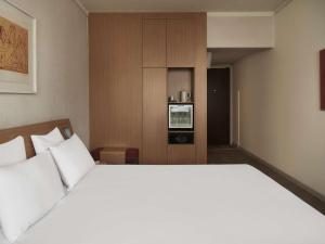 Postel nebo postele na pokoji v ubytování Novotel Athens