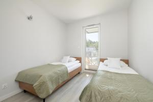 Postel nebo postele na pokoji v ubytování Luksusowy Apartament z Parkingiem i Spa w Zakopanem by Renters Prestige