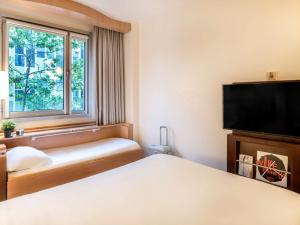 Posteľ alebo postele v izbe v ubytovaní Ibis Barcelona Plaza Glòries 22@