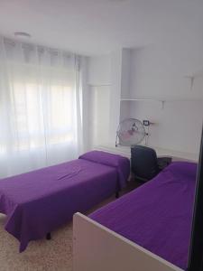 En eller flere senge i et værelse på Apartamento cerca del casco histórico de Tarifa + 7 billeder