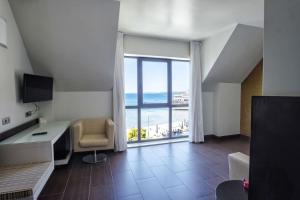 a living room with a view of the ocean at Alda Carril in Vilagarcia de Arousa